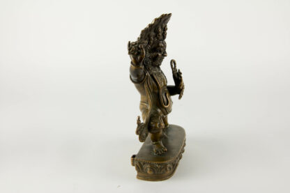 Bronzefigur, Tibet, um 1900 oder älter, Vajrapāṇi, eine der ersten Bodhisattvas im Mahayana Buddhismus. Er ist der Beschützer und Führer des Gautama Buddha und symbolisiert die Kraft Buddhas, sehr feine Ausarbeitung mit minimalen Resten einer Versilberung, Vergoldung und roter Bemalung, Mandorla fehlt, Sockel verschlossen, Gebrauchsspuren. H: 24 cm, Figure, Tibet, bronze, about 1900 or older, Vajrapāṇi is one of the earliest-appearing bodhisattvas in Mahayana Buddhism. He is the protector and guide of Gautama Buddha and rose to symbolize the Buddha's power, very fine worked, used, www.beyreuther.de