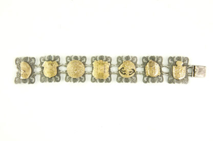 Armband, Mexiko, 20. Jh., 925er-Silber, und 10 Karat Gold, massives, gegliedertes Silberarmband, Glieder mit geprägten, und mit verschiedenen Motiven verzierten Goldblechen, Gebrauchsspuren, L: ca. 20 cm, 50 g.