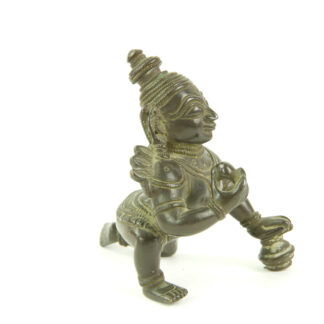 Krishna - Figur, Indien, 19./20. Jh., Bronze, Krishna kniend und Hand auf Butterkugel, Gebrauchsspuren. H: 8 cm.