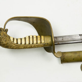 Säbel, deutsch, um 1880, Marine, vergoldetes Bronzegefäß mit Elfenbein-Griffstück und Löwenkopfabschluss, geätzte Eisenhauer-Klinge, Scheide mit Messingbeschlägen. Säbel stammt aus dem Besitz von Ferdinand Krokisius (Ferdinand Krokisius (1842–1908), Schiffsführer der Marie, eines der beiden Schiffe der Forschungsreise, Teilnehmer der Südpolarexpedition der Deutschen Polarkommission (1882–1883) unter der Leitung Carl Schraders im Zuge des Ersten Internationalen Polarjahres), unberührter Zustand mit Gebrauchsspuren, Scheide gebrochen, Provenienz: Ferdinand Krokisius, L: 95 cm.